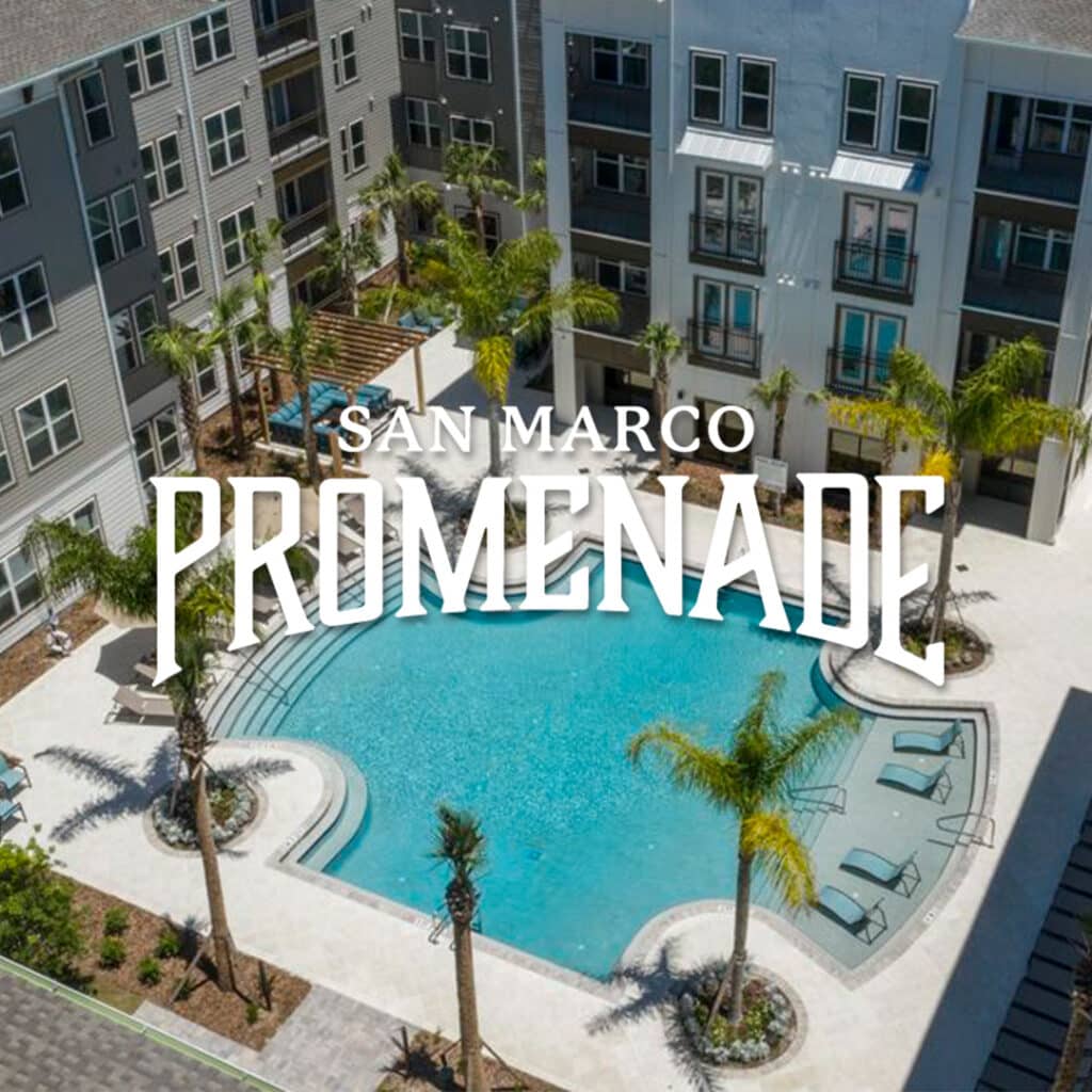 Aerial view of a residential complex featuring a kidney-shaped swimming pool surrounded by deck chairs and palm trees, with "San Marco Promenade" text overlay.